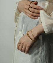 重ね付けで手元に存在感をもたせ、一気に垢抜けスタイル