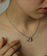 ニュアンス感のあるハートモチーフのトップ